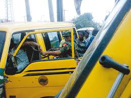 Lagos Bus Driver, Conductor and A Solider